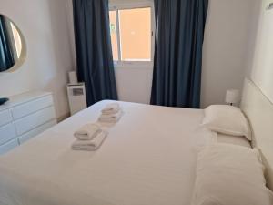 Posteľ alebo postele v izbe v ubytovaní Brisas Del Mar - Sunset Garden