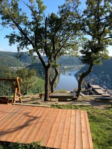 a wooden deck with a view of a lake at Ferienhaus Gartenblick in Brieden in Brieden