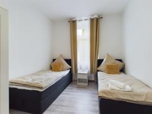 Ένα ή περισσότερα κρεβάτια σε δωμάτιο στο ElbeLounge Magdeburg