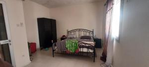 a bedroom with a bed in a room at Teranga in Ngaparou