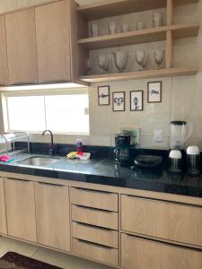 a kitchen with a sink and a counter top at Rosendo Maia n 19 Bairro Brasiliana in Arapiraca