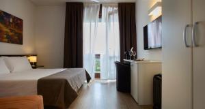 Postel nebo postele na pokoji v ubytování Hotel Eurorest