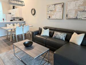 a living room with a couch and a table at Spacious 2 bedroom Lely Resort condo Naples FL in Naples
