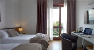 Postel nebo postele na pokoji v ubytování Hotel Eurorest + 37 fotografií