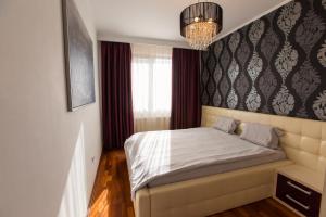 Giường trong phòng chung tại Clara Residence Two Room Cozy Apartment