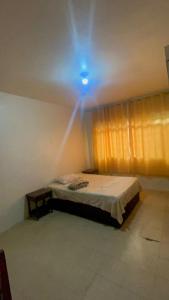 Postel nebo postele na pokoji v ubytování Hostel e Hotel Reale