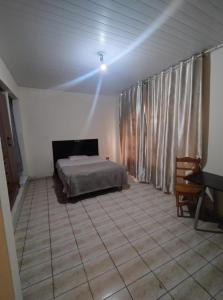 Postel nebo postele na pokoji v ubytování Hostel e Hotel Reale