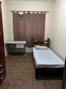 Postel nebo postele na pokoji v ubytování Hostel e Hotel Reale