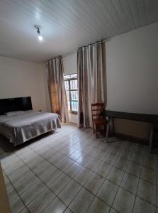 Postel nebo postele na pokoji v ubytování Hostel e Hotel Reale