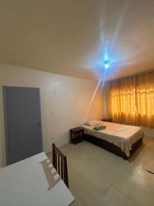 Postel nebo postele na pokoji v ubytování Hostel e Hotel Reale