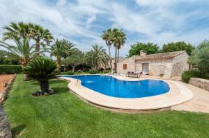 a swimming pool in the yard of a villa at Can Rovey in Inca