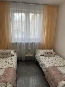 Posteľ alebo postele v izbe v ubytovaní Apartament Szpitalna