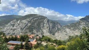 a small town in front of a mountain at La Perla del Dolcedorme in San Lorenzo Bellizzi
