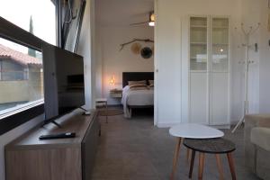 Μια τηλεόραση ή/και κέντρο ψυχαγωγίας στο Apartament Anna a Salàs