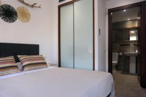 Ένα ή περισσότερα κρεβάτια σε δωμάτιο στο Apartament Anna a Salàs