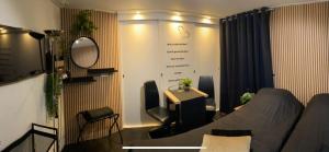 a room with a bed and a table and a desk at Bed en Breakfast Romee in Epe