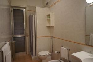 a bathroom with a toilet and a sink at Hotel Europa in Palermo