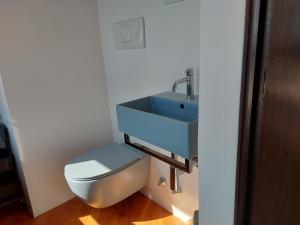 a bathroom with a sink and a toilet at Acquarium dream apartment kate in Genoa +32 photos