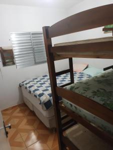 Ένα ή περισσότερα κρεβάτια σε δωμάτιο στο Chacara HMB +67 φωτογραφίες