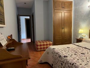 A bed or beds in a room at La Garzona