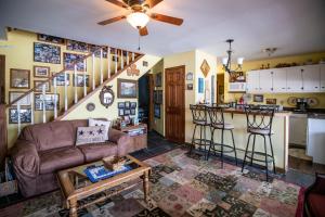a living room with a couch and a kitchen at Four Season Ski, Lake, And Golf Chalet on Lake Rescue in Tyson