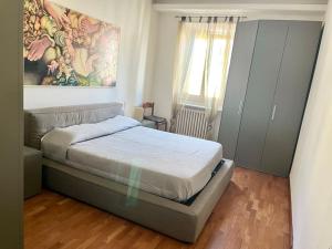 Una cama o camas en una habitación de In Via Gorizia dalla Fra