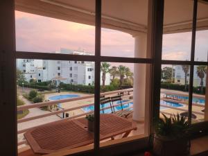 a view of a swimming pool from a window at Estrela do Oceano in Portimão