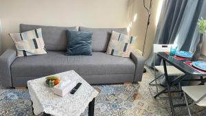 a living room with a couch and a table at Luxury Estudio CH&H in Benalmádena