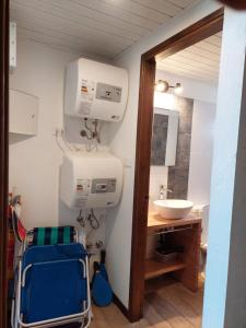 a bathroom with a sink and a mirror at Las Olas in Piriápolis +24 photos