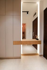 a bathroom with a sink and a mirror at Studio Compact in Doboj +12 photos
