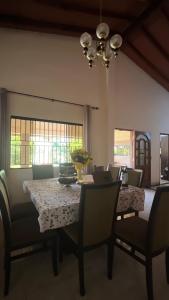 a dining room with a table and chairs at Habitacion privada en casa familiar in San Bernardino