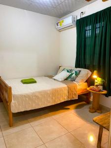 Ένα ή περισσότερα κρεβάτια σε δωμάτιο στο El Cabrero by Alohouse -Apartamentos en David