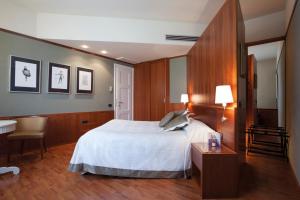 Letto o letti in una camera di Albergo Celide