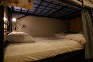 Letto o letti in una camera di Hiroei Hostel