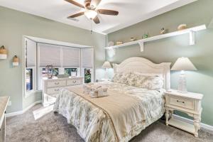 a bedroom with a bed and a ceiling fan at Lovely 3 Bed3 Bath Pet FriendlyVilla - Walk to the beach pools and tennis #75 Ocean Breeze in Hilton Head Island +30 photos
