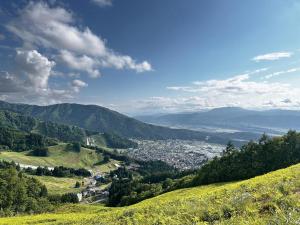 a view of a city from a hill at 蔕 Heta Nozawa Onsen in Nozawa Onsen