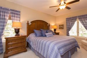 a bedroom with a bed and a ceiling fan at Beautiful 2 Bed2 Bath Shelter Cove Anchorage Villa in Hilton Head Island +31 photos