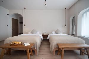 Postel nebo postele na pokoji v ubytování 迦尔纳酒店
