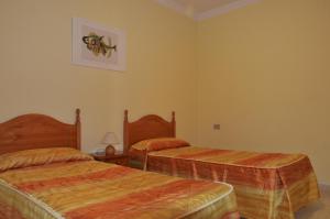 Ein Bett oder Betten in einem Zimmer der Unterkunft Casa la Ermita