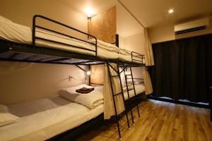 Letto o letti in una camera di Hiroei Hostel