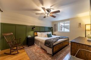 a bedroom with a bed and a ceiling fan at Creekside Condos #7 by Summit County Mountain Retreats in Frisco