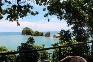 a view of the ocean from a balcony at Anjawan Island Resort in Sipalay