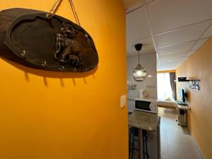 a large bowl hanging from a wall in a kitchen at Bali Holiday Resort in Hong Kong