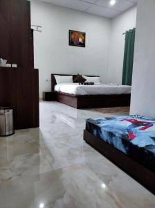Letto o letti in una camera di Spring Inn Bir-Billing