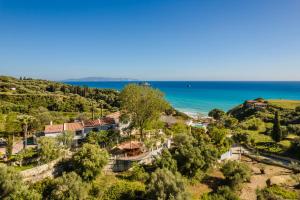 an aerial view of a resort with the ocean in the background at Costa Avithos in Svoronata