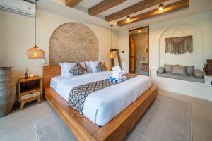 a bedroom with a large white bed in a room at Casa Tua - Hidden Ubud Gem Views in Ubud