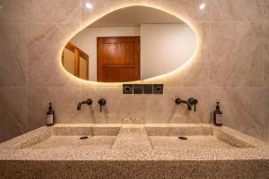 a bathroom with a large sink with a mirror at Casa Tua - Hidden Ubud Gem Views in Ubud +33 photos