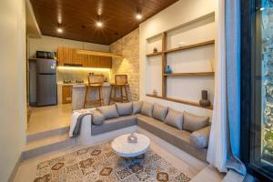 a living room with a couch and a table at Casa Tua - Hidden Ubud Gem Views in Ubud