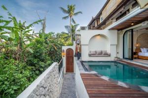 a villa with a swimming pool and a house at Casa Tua - Hidden Ubud Gem Views in Ubud