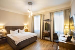 Postel nebo postele na pokoji v ubytování Boardinghouse Pfarrkirchen